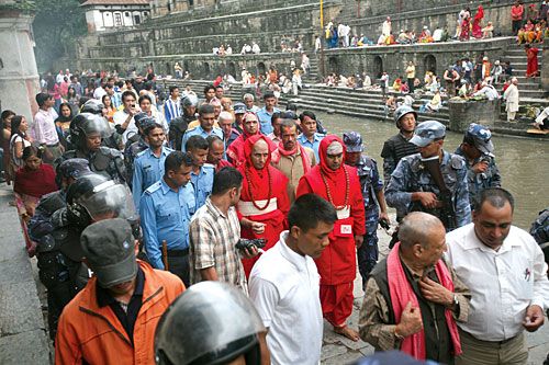 DIVINE PROTECTION: Indian nationals Girish and Raghavendra Bhatta undertake initiation rituals on Saturday before beginning priestly duties at Pashupati Temple. The two were earlier beaten up by Maoists protesting the tradition of appointing Indian priests at the shrine.