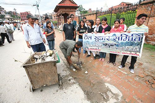 SAMARITANS: Members of a 'Neighborhood Improvement Committee' help clean up the Pashupati area on Wednesday as part of a campaign to raise awareness about cleanliness in the city.
