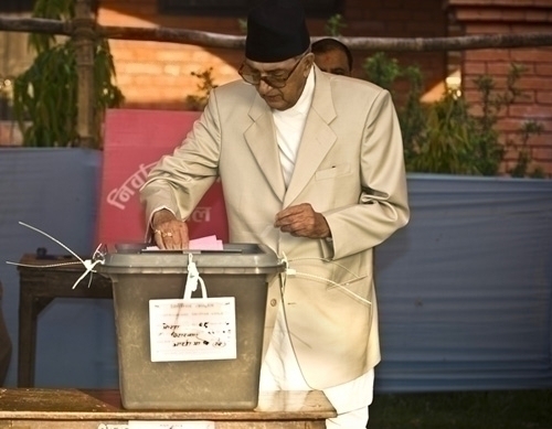 PREMIER VOTE: Prime Minister Girija Prasad Koirala casts his vote in Ward 9's election area 7, Morang District, Biratnagar.