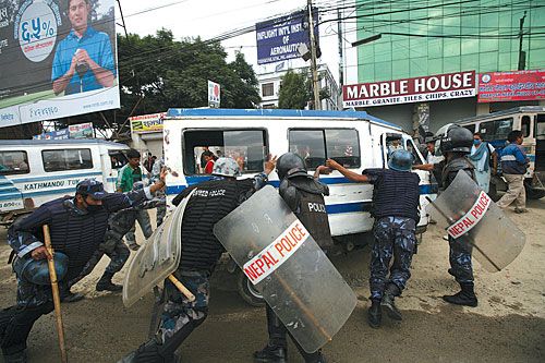 YES, OFFICER? Police stop a LPG three-wheeler as it tries to evade them after protesting a government decision to gradually replace the vehicles with microbuses in the Valley.
