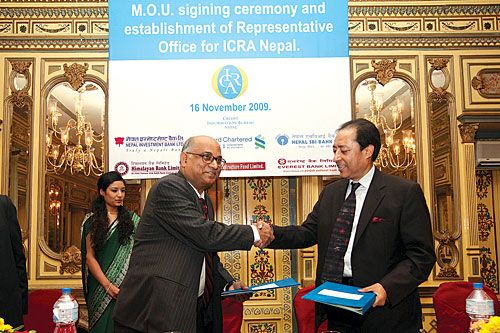 DONE DEAL: Prithivi Pande of Himalayan Infrastructure Fund and P.K. Choudhary of ICRA Limited shake hands on Wednesday after agreeing to a joint venture to set up a credit rating agency in Nepal.