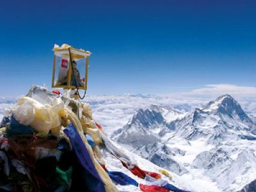 PEAKING ATTENTION: A Buddha figure on the summit of Chomolungma earlier this year. Mountaineers say climate change has made climbing the world's highest mountain more treacherous.