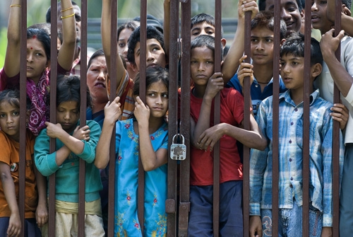 NO GO: Children wait while their parents cast their votes in Biratnagar-3. Elsewhere in the country, eligible adults were also prevented from entering the booths because of party disputes, booth captures and violence, which resulted in at least one dead.
