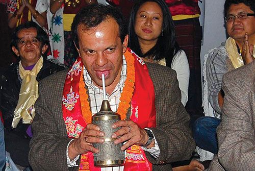 THIRSTY: Culture Minister Minendra Rijal sipping Tongba, or millet beer, during the inauguration of the Nepal International Indigenous Film Festival on Tuesday in Dharan.