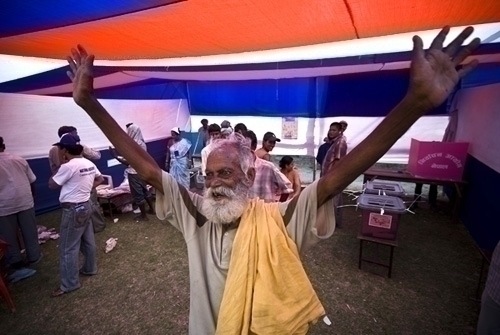 IT'S OVER: 78-year-old Shukal Giri from Biratnagar-5, Ekrai, raises his hand in elation after successfully casting his vote at Janapath Higher Secondary School. He had waited for five hours in line to cast his vote.