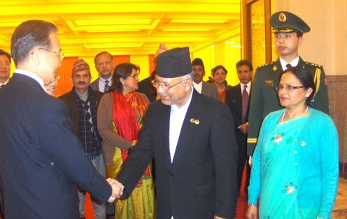 Chinese Premier Wen Jiabao greets Prime Minister Madhav Kumar Nepal at the Great Hall of the People in Beijing on Tuesday. The two countries signed an economic cooperation and trade agreement.