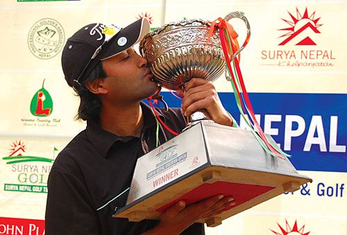 CHAMPION: Sabin Sapkota lifts a trophy after winning the Surya Nepal Eastern Open in Dharan last week.