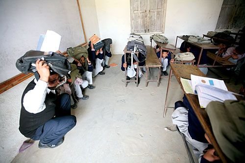 WATCH OUT! Students of Adarsha Secondary School during an earthquake drill organised by the National Society for Earthquake Technology and School Earthquake Safety Division on Monday.