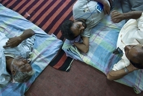 LONG WAIT: (l-r) Ganga Prasad Yeadad, Manoj Kumar Yeadad and Bhimshen Yeadad rests while waiting for vote counting to begin. The three volunteers have been waiting since yesterday at the vote counting centre (Adarsha Higher Secondary School) in Morang dis