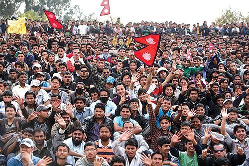 HERE WE COME: Nepali fans celebrate after the national cricket team beat the United States to win the Pepsi ICC World Cricket League Division 5 tournament in Kirtipur on Saturday.