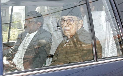 LONG MARCH HOME: Girija Prasad Koirala and his doctor, Jagdish Agarwal, on their way to Sujata Koirala's home on Friday.