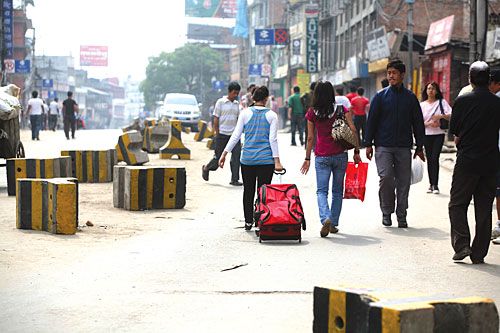 FEW HURDLES: Locals take to the streets on foot as all vehicles are barred. Some tourists were evacuated from the country with the help of the army.