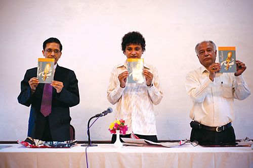 PURE POETRY: Standard Chartered CEO Sujit Mundul (left) launches his book of verse, 'Confluence', at Yala Maya Kendra, Monday, in the company of writer Sanjeev Uprety and poet Manjul.