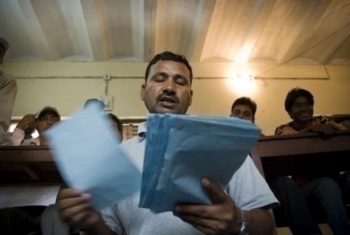 COUNT OUT LOUD: Ganesh Karki reads out the ballot count for Biratnagar-8, Morang, as other volunteers take note. There are a total of 648,894 eligible voters in Morang district. Officials estimate a 60% turnout.