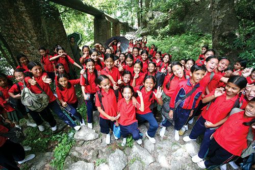 SCHOOL IS HARD WORK: School children from Kathmandu take a hike in Sundarijal as part of their school field trip on Sunday.