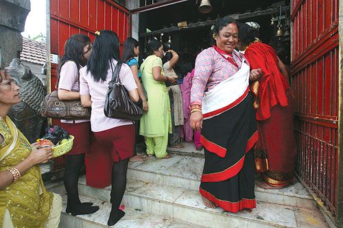 OLD TRADITIONS: Young girls and women queue outside Chobar's Jal Binayak on Mangal Chaturdashi on Tuesday.