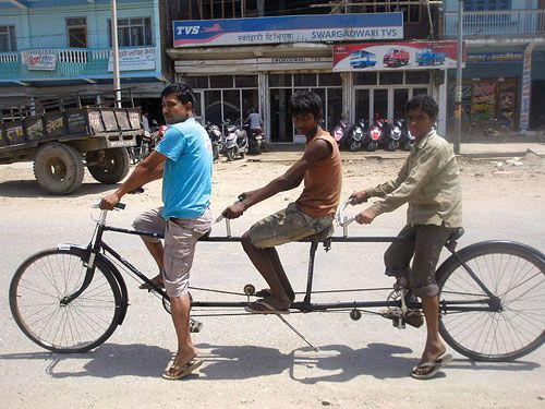 TRIPLE TANDEM: Mohammad Isdakhad of Ghorahi takes a ride on his bike designed to carry three people, which can be pedalled by two.