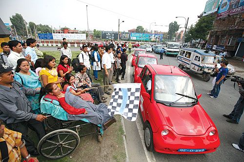 CLEAN RIDE: Goma Dulal, a quadriplegic, inaugurates the Spinal Injury Electric Vehicle Rally from Maitighar Mandala to Sangha, Saturday, World Environment Day.
