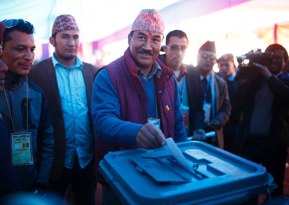 Rashtriya Prajatantra Party (RPP) leader Kamal Thapa casts his vote during the party's election in Kathmandu on Monday. Thapa is one of the two candidates vying for the leadership of the newly-unified party, which aims to restore Nepal as a Hindu monarchy.