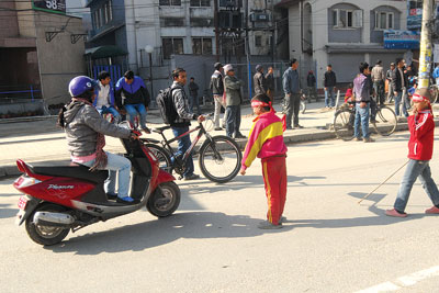 BRIGHT FUTURE: Children activists of CPN-Maoist stop a driver in Baneswor on Tuesday for defying the party’s banda.