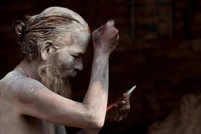 JAI SHAMBO: A sadhu at Pashupatinath puts on tika and gets ready for the day on early Wednesday morning.