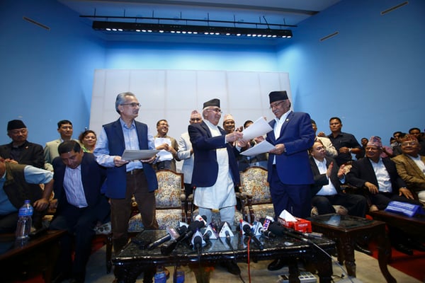 UML Chair KP Oli (centre), CPN (Maoist-Centre) Chief Pushpa Kamal Dahal (right) and New Force's Coordinator Baburam Bhattarai ink a six-point deal at a press conference in Kathmandu on Tuesday. Under the deal, the three parties will first join hands to contest elections in November and announce a unified party later.