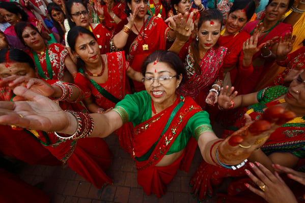 Women sing and dance on the occasion of Haritalika Teej at Pashupati on Wednesday. On this day, women pray for the well being of their husbands.