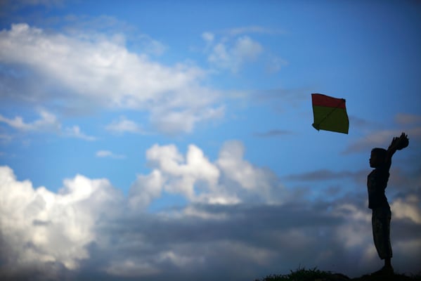 A boy flies kite from the bank of Bagmati River on Friday.