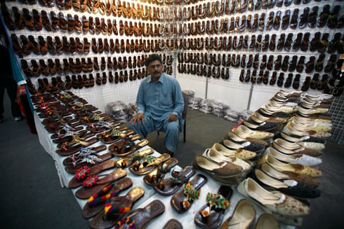 SHOE LOVE: A stall owner waits for customers on the first day of Made in Pakistan exhibition at United World Trade Centre in Tripureshwor on Wednesday.