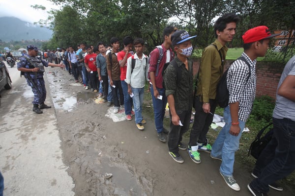 Applicants queue to submit their Employment Permit System (EPS) forms for Korea in a centre at Kirtipur on Monday.