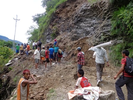 CAUTION: Locals of Babiya Chaur in Myagdi clear the road that was swept by landslide on Thursday.