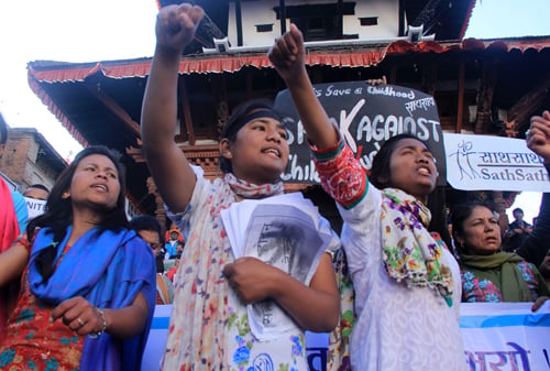 Participants of a rally held in Kathmandu on Wednesday shout slogans demanding justice for victims of Bara rape case and Jhonchhe acid attack.