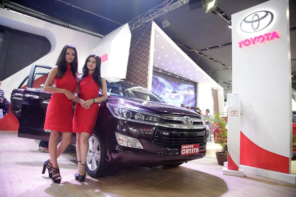 Models pose in front of a Toyota car during the NADA Auto Show 2016 at Bhrikuti Mandap, Kathmandu on Tuesday. The show will go on till 4 September.