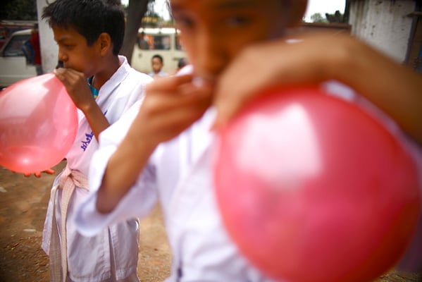 Students from Darbar High School prepare balloons to decorate classrooms on the occasion of Guru Purnima in Kathmandu on Tuesday.
