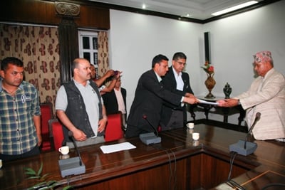 NO YOU CAN'T: Citizens submit a memorandum to President Ram Baran Yadav at Shital Niwas on Sunday to prevent the appointment of Lokman Singh Karki as CIAA chief.