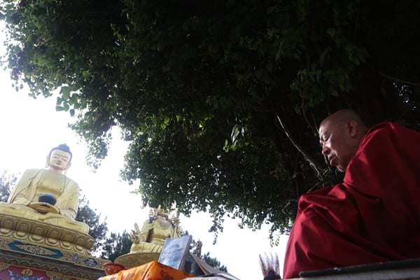 A Buddhist monk in a state of meditation on the premise of Swayamhhu, Kathmandu on Monday.