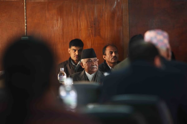 UML Chairman KP Oli listens during a meeting of the Political Dialogue Consensus Committee at Singha Durbar on Tuesday.