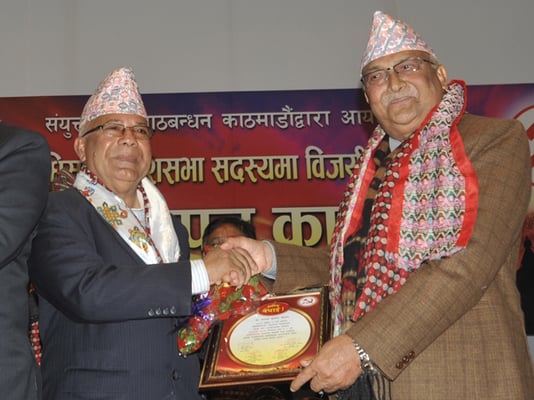 Chairman of CPN-UML KP Oli felicitates UML leader Madhav Kumar Nepal during a program organised by the left alliance to felicitate the winners of the provincial and parliamentary elections in Kathmandu on Wednesday.