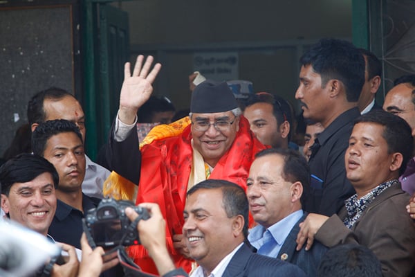 Nepali Congress President Sher Bahadur Deuba waves to his supporters after being elected as the parliamentary party leader on Wednesday.