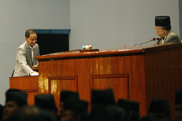 Constitution Drafting Committee (CDC) Chair Krishna Sitaula tables the new constitution's bill in the Constituent Assembly (CA) on Sunday amidst protests by Madhesi, Tharu and Janajati lawmakers.