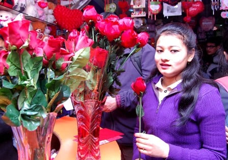 ROSES ARE RED: A woman buys flowers on Thursday for Valentine's Day.
