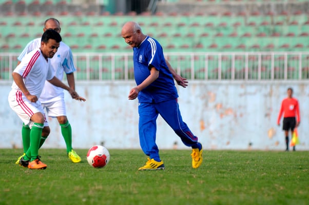 Prime Minister KP Oli in action during a friendly match between Prime Minister-XI and Chief Secretary-XI at Dasrath Stadium, Kathmandu on Sunday. Chief Secretary-XI won the game 3-2.
