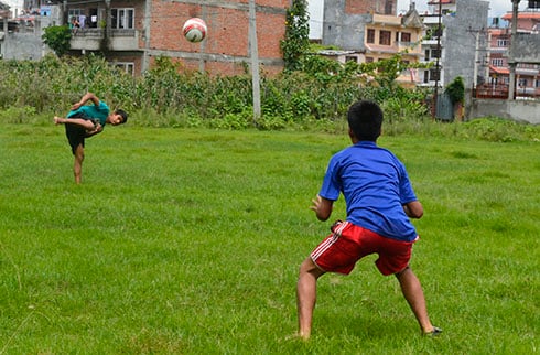 GOAL: Young boys playing football near Boudha on Friday.