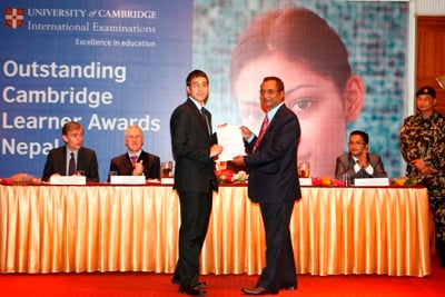WELL-DONE: - Soul Raj Joshi of Rato Bangala School receives an award for his top results in Cambridge International Examinations at Everest Hotel on Wednesday