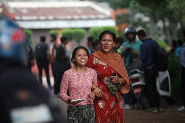 An exultant girl walks home with her mother at Sano Thimi, Bhaktapur after receiving the results of the SLC exams on Thursday. The SLC exams will no longer take place from next year.