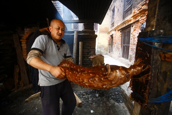 A sweet maker in Lalitpur prepares molasses or Chaku as is called in Nepali for the upcoming Maghe Sankranti Festival on Thursday.