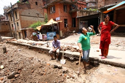 COOL DOWN: Workers take a break and drink water on a hot Sunday afternoon in Patan.