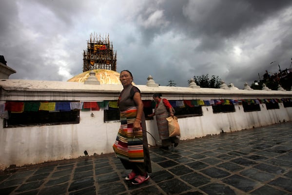 Buddhist women circumambulate the Boudhanath Stupa on Thursday.