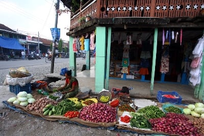 FERTILE SOIL: A woman sets up her vegetable stall by the side of the road in Letang on Thursday morning.