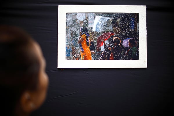 A visitor looking at a photograph during an exhibition at the Nepal Tourism Board (NTB), Exhibition Road on Thursday. The exhibition, which showcases pictures of monsoon in Nepal, is part of the #photoNepal series.